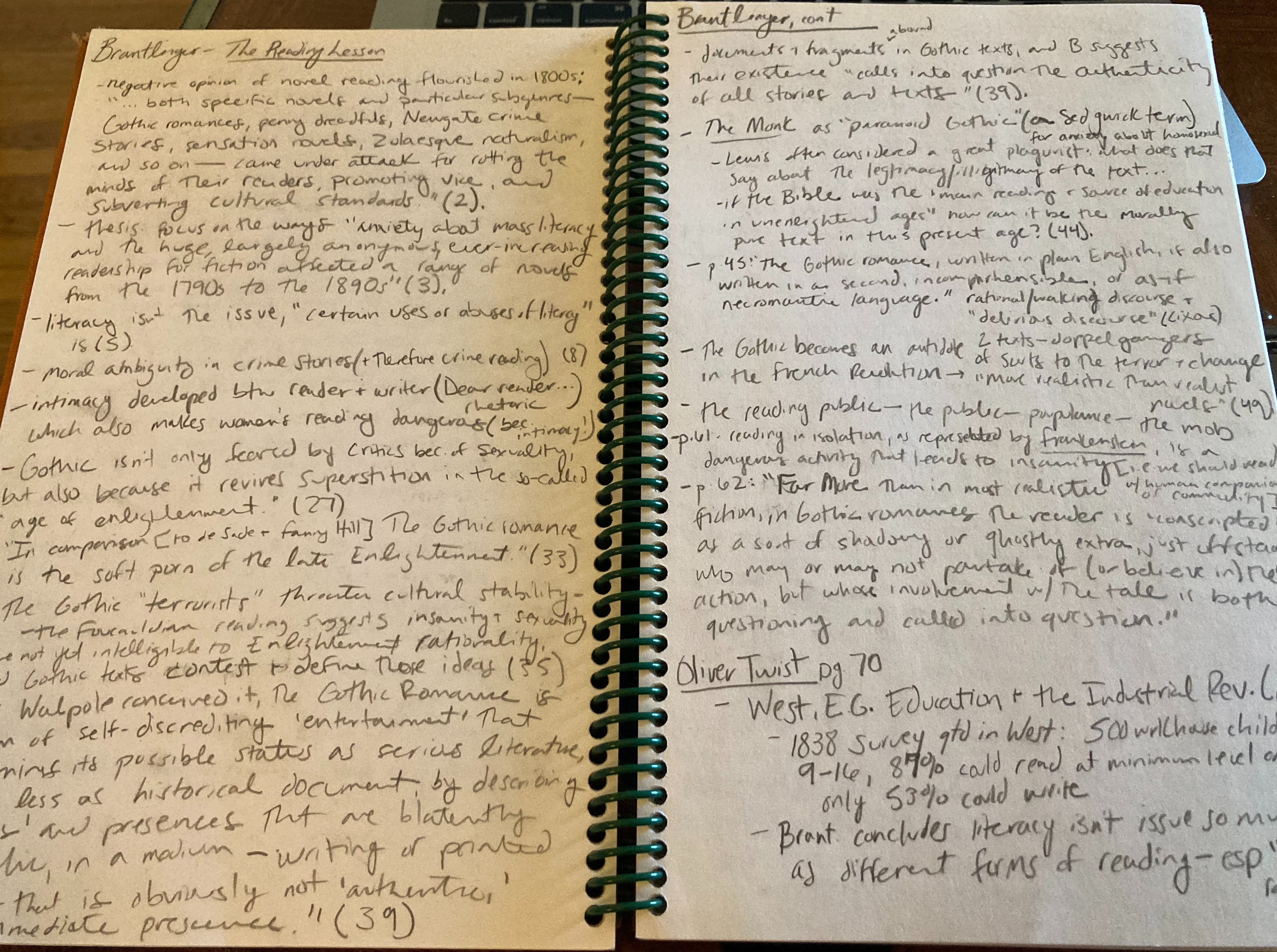 open spiral notebook filled with pencil notes